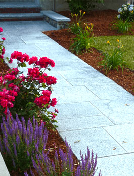 patios and walkways hardscape and masonry stone path with flowers shrubs surrounding black diamond landscapes