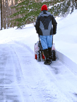 residential snow removal man pushing snow plow in driveway snow and ice removal black diamond landscapes