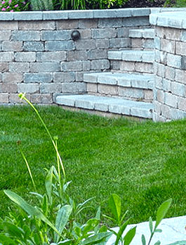 walls and stairs hardscape and masonry retaining wall green lawn black diamond landscapes